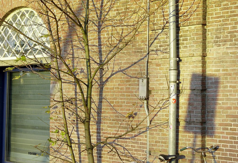 Commercial brick facade and parapet under masonry repair